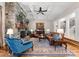 Inviting living room features coffered ceilings, a stone fireplace, and hardwood floors at 13215 Claysparrow Rd, Charlotte, NC 28278