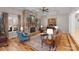 Inviting living room features coffered ceilings, a stone fireplace, and hardwood floors at 13215 Claysparrow Rd, Charlotte, NC 28278