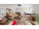 Comfortable living room features a piano, desk, and traditional décor at 13215 Claysparrow Rd, Charlotte, NC 28278
