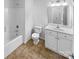 Clean bathroom featuring a shower-tub combo, tiled floors, and vanity with sink at 134 Burke Cir, Mooresville, NC 28115