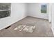 Bright bedroom featuring neutral carpet and two windows at 134 Burke Cir, Mooresville, NC 28115