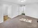 A spacious bedroom featuring neutral carpet and dual closets at 134 Burke Cir, Mooresville, NC 28115