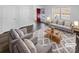 Bright living room with neutral furniture, a patterned rug, and ample natural light at 134 Burke Cir, Mooresville, NC 28115
