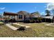 Backyard with a deck, carport, landscaping, and covered parking at 1420 28Th Sw St, Hickory, NC 28602
