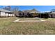 Backyard with landscaping, carport, a garden bed, and covered parking at 1420 28Th Sw St, Hickory, NC 28602