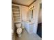 Cozy bathroom featuring a toilet, vanity with storage, mirror, and an open storage unit at 1420 28Th Sw St, Hickory, NC 28602