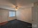 Bedroom with carpet, ceiling fan, and a door to the exterior at 1420 28Th Sw St, Hickory, NC 28602