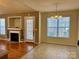 Dining area and living room featuring hardwood floors and a fireplace for a cozy atmosphere at 1420 28Th Sw St, Hickory, NC 28602