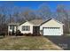 Well-maintained single-story home featuring a two-car garage and a cozy front entrance at 1420 28Th Sw St, Hickory, NC 28602