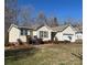 Charming single-story home with a well-manicured lawn, attached garage, and inviting front porch at 1420 28Th Sw St, Hickory, NC 28602