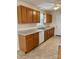 Well-lit kitchen features wooden cabinets, ample counter space, and essential appliances at 1420 28Th Sw St, Hickory, NC 28602