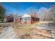 A charming brick home with a paved walkway, and a well-manicured lawn at 1547 Kings Rd, Shelby, NC 28150