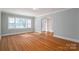 Bright living room with hardwood floors and large windows for ample natural light at 1547 Kings Rd, Shelby, NC 28150