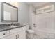 Bathroom with granite countertop, vanity, mirror, tub, and tile flooring at 2069 Landry Ln # 233, Rock Hill, SC 29732