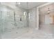 A bright, modern bathroom showcasing a glass shower with marble tile and updated fixtures at 2069 Landry Ln # 233, Rock Hill, SC 29732