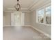 Primary bedroom with neutral carpet, decorative ceiling, large window, and ensuite bathroom at 2069 Landry Ln # 233, Rock Hill, SC 29732