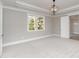 A neutral bedroom with a large window and decorative ceiling molding at 2069 Landry Ln # 233, Rock Hill, SC 29732