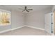 This bedroom features neutral carpeting and a ceiling fan, offering a cozy and comfortable space at 2069 Landry Ln # 233, Rock Hill, SC 29732