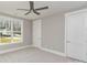 Bright bedroom with a large window and a ceiling fan, creating a comfortable living space at 2069 Landry Ln # 233, Rock Hill, SC 29732