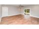Versatile bonus room with hardwood floors and sliding doors to outdoor living space at 2069 Landry Ln # 233, Rock Hill, SC 29732
