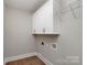 Functional laundry room with overhead cabinets, providing practical storage solutions at 2069 Landry Ln # 233, Rock Hill, SC 29732