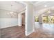 A well-lit living area with hardwood floors, white trim, and large windows leading to an outdoor deck at 2069 Landry Ln # 233, Rock Hill, SC 29732