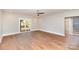 Expansive living room featuring gleaming hardwood floors and sliding glass doors to the outside at 2069 Landry Ln # 233, Rock Hill, SC 29732