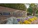 Meadow Lakes community sign surrounded by colorful spring flowers and manicured landscaping at 2069 Landry Ln # 233, Rock Hill, SC 29732
