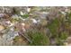 The home's location within a quiet neighborhood is shown from an aerial view at 207 Pebble Creek Xing, Fort Mill, SC 29715