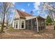 This home features a charming screened-in porch, great for relaxing outdoors at 207 Pebble Creek Xing, Fort Mill, SC 29715