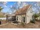 A charming backyard featuring a lovely screened porch and scenic pond at 207 Pebble Creek Xing, Fort Mill, SC 29715