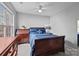 Bright bedroom featuring a large window, wooden furniture, and a neatly made bed with stylish pillows at 207 Pebble Creek Xing, Fort Mill, SC 29715