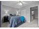 Inviting bedroom with cozy carpeting, neutral paint, and a comfortable queen-sized bed with bedside tables at 207 Pebble Creek Xing, Fort Mill, SC 29715