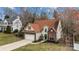 Lovely two-story home featuring a brick facade, two-car garage, and landscaped front yard at 207 Pebble Creek Xing, Fort Mill, SC 29715