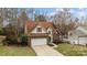 Attractive two-story home with a two car garage and sidewalk leading to the front door at 207 Pebble Creek Xing, Fort Mill, SC 29715