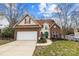 Beautiful two-story home featuring a brick facade and well-manicured landscaping at 207 Pebble Creek Xing, Fort Mill, SC 29715