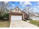 Charming two-story home with a brick and siding exterior, featuring an attached two-car garage at 207 Pebble Creek Xing, Fort Mill, SC 29715