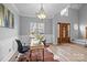 Bright office space with hardwood flooring, a large window, and stylish decor at 207 Pebble Creek Xing, Fort Mill, SC 29715