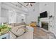 Inviting living room features high ceilings, fireplace, and a staircase leading to a second-floor loft area at 207 Pebble Creek Xing, Fort Mill, SC 29715