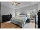 Relaxing primary bedroom with natural light, wood flooring, and a spacious layout at 207 Pebble Creek Xing, Fort Mill, SC 29715