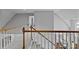 Bright staircase with white railings, wooden banisters, and neutral carpet with a view to the living area at 207 Pebble Creek Xing, Fort Mill, SC 29715