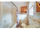 Bathroom features tiled shower, vanity with sink, window and medicine cabinet at 222 Weldon Cir, Mount Holly, NC 28120