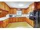 Kitchen with lots of beautiful wood cabinets, solid surface countertops and view of outdoors at 222 Weldon Cir, Mount Holly, NC 28120