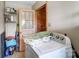 Practical laundry area, with washer and a vintage door at 222 Weldon Cir, Mount Holly, NC 28120