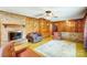 Inviting living room featuring a brick fireplace, built-in shelves, and classic wood accents at 222 Weldon Cir, Mount Holly, NC 28120