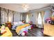 Bright bedroom featuring a ceiling fan and mural wall art at 2622 Rolling Ridge Dr, Hickory, NC 28602