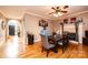 Spacious dining area featuring hardwood floors, a fireplace, and an arched entryway at 2622 Rolling Ridge Dr, Hickory, NC 28602