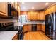 Traditional kitchen with stainless steel appliances, wooden cabinets, and hardwood flooring at 2622 Rolling Ridge Dr, Hickory, NC 28602