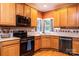 The kitchen features wood cabinets, granite countertops, and stainless steel appliances at 2622 Rolling Ridge Dr, Hickory, NC 28602