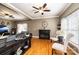 Cozy living room with hardwood floors, fireplace, ceiling fan and plenty of natural light at 2622 Rolling Ridge Dr, Hickory, NC 28602